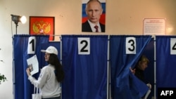 Rusya'daki seçimlerde Putin'in bir kez daha devlet başkanı seçilmesine kesin gözüyle bakılıyor
